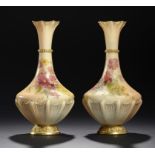 A PAIR OF ROYAL WORCESTER VASES, 1911  printed and painted with naturalistic flower sprays, 27cm