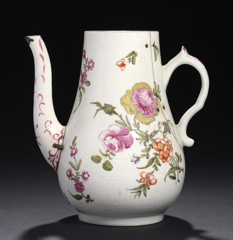 A LOWESTOFT POLYCHROME TEAPOT, C1775-80  with unusual handle, painted with large floral sprays and