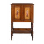 AN ARTS & CRAFTS MAHOGANY MUSIC CABINET, C1870  the satinwood door panel decorated in pokerwork