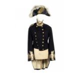 NAVAL UNIFORM. TWO ROYAL NAVY OFFICERS FROCK COATS, A PAIR OF TROUSERS AND THREE COCKED HATS,  C1900