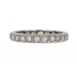 A DIAMOND ETERNITY RING with round brilliant cut diamonds, platinum mount, size S ++In good second