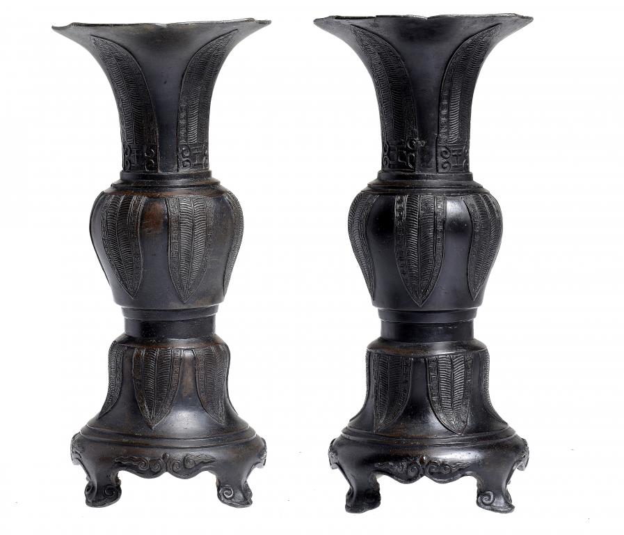 A PAIR OF CHINESE BRONZE VASES, 19TH/20TH C   cast with lappets, on four feet, 41cm h ++The pear