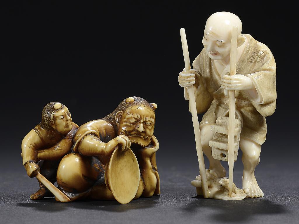 A JAPANESE STAINED IVORY OKIMONO OF A DRUNKEN SHUTEN DOJI AND A YAMABUSHI AND A NETSUKE OF A MAN