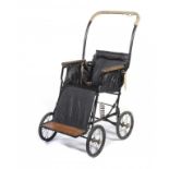 A PEDIGREE MODEL 560 "UTILITY" PUSHCHAIR, 1949 of black painted ferrous metal, black leather cloth