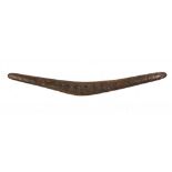 ABORIGINAL AUSTRALIA.  A BOOMERANG, LATE 19TH/EARLY 20TH C   one side profusely carved with the head