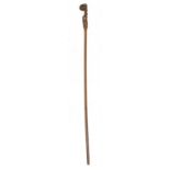 FOLK ART.  AN UNUSUAL CARVED WALKING CANE OF FINELY PATINATED WOOD, 19TH C carved with the full