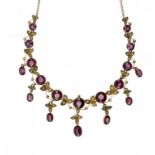 AN ALMANDINE GARNET, SPLIT PEARL AND GOLD NECKLACE, C1910 ++Dirty and requires cleaning but complete