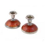 A PAIR OF NORWEGIAN SILVER AND CHERRY RED GUILLOCHE ENAMEL MINIATURE CANDLESTICKS 4.5cm h by Norsk