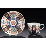 A WORCESTER FLUTED QUEEN'S PATTERN COFFEE CUP AND SAUCER, C1768-75 saucer 11.5cm diam, fretted