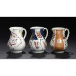 THREE WORCESTER SPARROW BEAK JUGS, C1770-75 enamelled in the Famille Rose palette with a Meissen