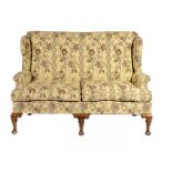 A GEORGE I STYLE SETTEE, C1900 on walnut legs, 114cm h, 155cm w ++Structurally very sturdy,