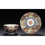 A WORCESTER FLUTED RICH QUEEN'S PATTERN TEA BOWL AND SAUCER, C1768-75  saucer 12cm diam, fretted