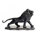 A JAPANESE BRONZE SCULPTURE OF A LION, MEIJI  19.5cm h, stamped  N Seiho, wood stand ++Dusty but
