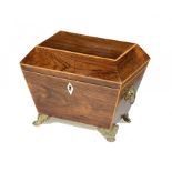 A REGENCY ROSEWOOD AND LINE INLAID TEA CADDY, C1820  sarcophagus shaped, the fitted interior