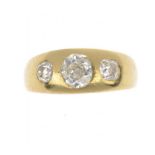 A DIAMOND RING with cushion shaped old cut diamonds in gold, size V ++In second hand condition