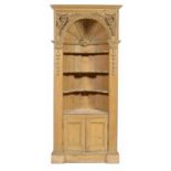 A KENTIAN STYLE PINE CORNER CUPBOARD, EARLY 20TH C  with barrel back, grape and other appliqués,