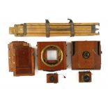 TWO MAHOGANY AND BRASS HALF PLATE CAMERAS, TWO THORNTON PICKARD PATENT TIME & INST. SHUTTERS, A