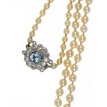 A CULTURED PEARL NECKLACE WITH AQUAMARINE AND DIAMOND CLASP the cultured pearls ranging from 3.2-7mm