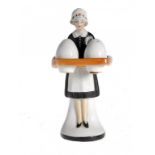 A GERMAN PORCELAIN FIGURAL CRUET IN THE FORM OF A WAITRESS CARRYING A TRAY, 1920S   12cm h and