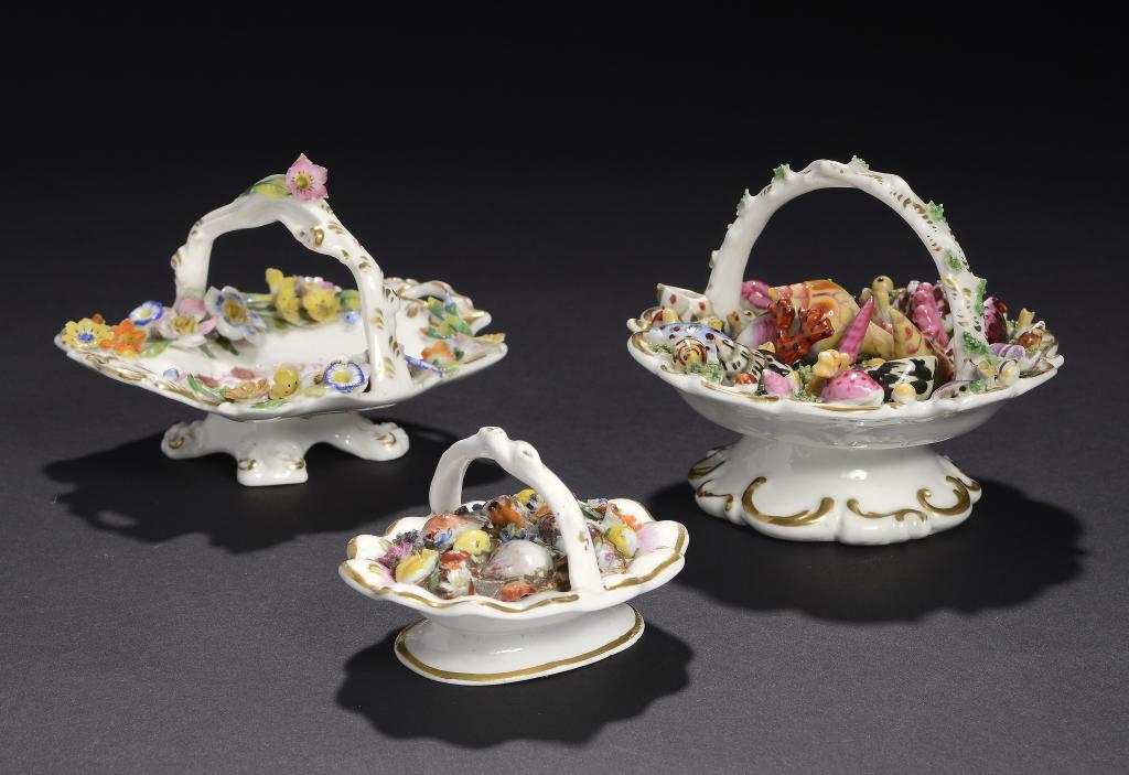 THREE ENGLISH PORCELAIN TOY BASKETS, C1830  two encrusted with flowers, the largest filled with