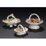 THREE ENGLISH PORCELAIN TOY BASKETS, C1830  two encrusted with flowers, the largest filled with