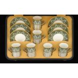 A SET OF SIX WEDGWOOD BONE CHINA COFFEE CUPS AND SAUCERS WITH SILVER HOLDERS, C1930   saucers 12cm