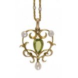 A PERIDOT, CULTURED PEARL AND GOLD OPENWORK PENDANT on a gold necklet with cultured pearls at