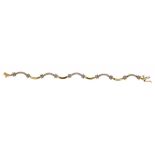 A DIAMOND BRACELET in gold, fully articulated, marked 14k ++In good condition, as new, total diamond