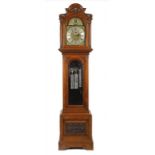 AN EDWARD VII OAK LONGCASE CLOCK, C1910  with brass breakarched dial with CHIME/SILENT  dial to