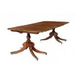 A GEORGE IV MAHOGANY TWIN PILLAR DINING TABLE, EARLY 19TH C  with two leaves and brass castors, 72cm
