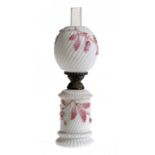 A MOULDED WHITE GLASS AND PINK PAINTED OIL LAMP AND SHADE, LATE 19TH C   both spirally reeded, brass