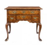 A GEORGE II WALNUT LOWBOY, C1740   with quarter veneered top, 71cm h; 52 x 84cm ++Fine colour and in