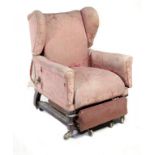 A VICTORIAN MAHOGANY ARMCHAIR, C1880  with adjustable wing back, hinged arms and retractable foot