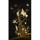 A JAPANESE CARVED BONE AND MOTHER OF PEARL INLAID LACQUER PANEL, MEIJI   with flowering plants, a