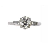 A DIAMOND SOLITAIRE RING   with baguette diamonds to the shoulders, in platinum, unmarked, size
