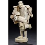 A JAPANESE SECTIONAL IVORY AND WOOD FIGURE OF A BASKET SELLER, EARLY 20TH C  27cm h ++Apparently