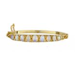 AN OPAL AND DIAMOND BRACELET in gold ++In fine condition, gross weight 11g