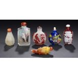 SIX CHINESE SNUFF BOTTLES  comprising red overlay snowflake glass carved with a bird and tethered