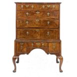 A GEORGE II WALNUT AND FEATHERBANDED CHEST ON STAND  with quarter veneered top, 145cm h;  58 x