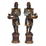 A PAIR OF CARVED AND PAINTED WOOD BLACKAMOORS WITH BASKETS, 20TH C  on integral fluted plinth, 180cm