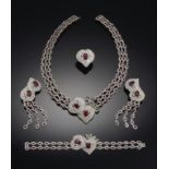 A RUBY AND DIAMOND PARURE with pear shaped and oval ruby and diamond clusters, in white gold