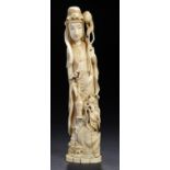 A JAPANESE IVORY OKIMONO OF GUANYIN RIDING A DRAGON WITH LOTUS FLOWER AND FLASK, MEIJI  31cm h ++The