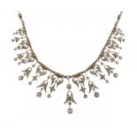 A DIAMOND NECKLACE, C1900 fully articulated, the ends demountable for wear as a bracelet ++In fine