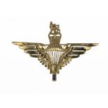 A PARACHUTE REGIMENT GOLD SWEETHEART BROOCH  set with a step cut sapphire, marked 9ct ++Some signs