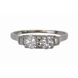 AN ART DECO DIAMOND RING, C1930 with round brilliant and baguette cut diamonds in platinum, marked