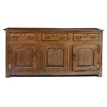 A GEORGE III OAK DRESSER, EARLY 19TH C  with raised-and-fielded ogee panels, 88cm h; 53 x 183cm ++