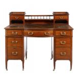 AN EDWARD VII MAHOGANY BOW CENTRED PEDESTAL DESK, C1905 with brass swag handles and tooled dark