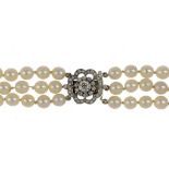 A CULTURED PEARL NECKLACE  with diamond clasp ++In fine condition, the diamonds all present and in