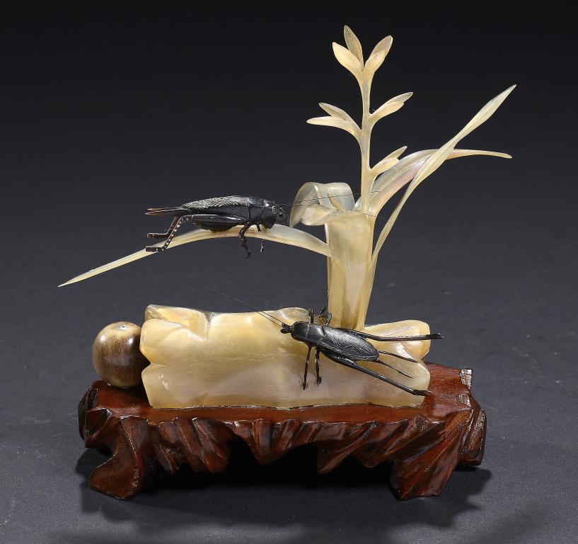 A JAPANESE HORN CARVING OF CRICKETS ON A PLANT, LATE 20TH C  affixed wood stand, 13cm h ++Complete