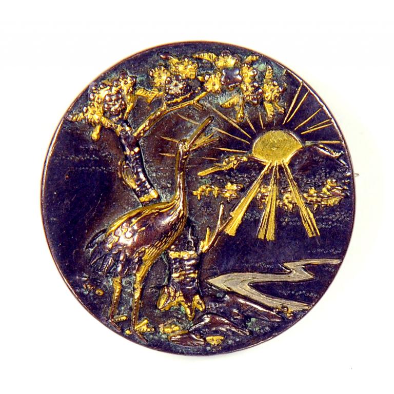 A JAPANESE SHIBUICHI AND SHAKUDO PLAQUE, MEIJI, MOUNTED AS A BROOCH